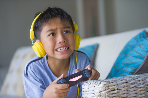 Child playing a video game.
