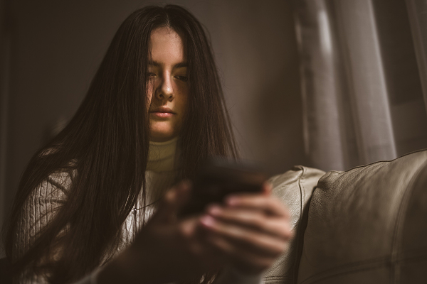 Teen looking at her phone.