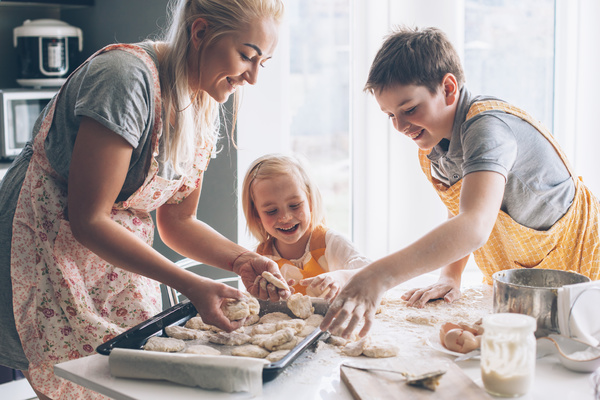 Parent and children cooking together.