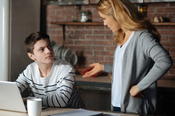 Parent talking to her teen.