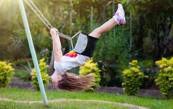 Child swinging on a swing.