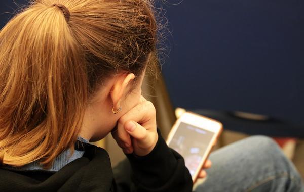 Teen looking at her phone.