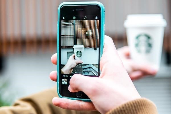Taking a photo with a smartphone.